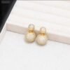 2026/07/1000127391-1.jpg Boucles d'oreilles double face zircons dorées