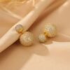 2026/07/1000127395.jpg Boucles d'oreilles double face zircons dorées