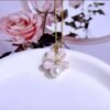 2026/07/1000137846.jpg Parure fleur perle véritable dorée