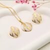 Parure ovale motif vague, ton or et blanc