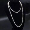 2026/09/1000156479.jpg Sautoir perles blanches nacrées