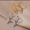 Créoles pendantes croix pavée zircons
