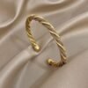 2026/09/1000220480.jpg Bracelet jonc torsadé maille dorée