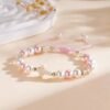 2026/09/1000220498.jpg Bracelet perles roses croix nacrée